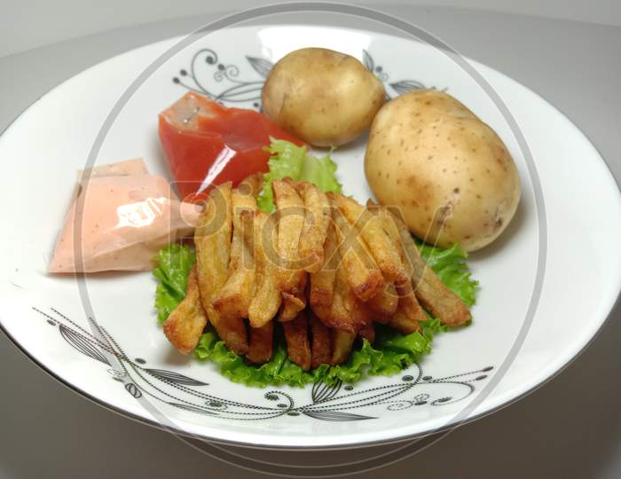 French Fries Stock With Sauce And Potato And Lettuce