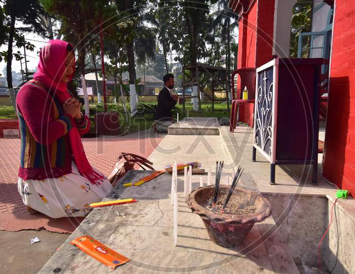 Devotees  light candle at  a church on the occasion of Christmas  Assam on Dec 25,2020