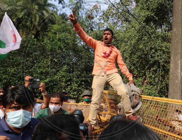 Demonstrators attempt to cross a police barricade during a protest of farmers and members of various agricultural against new farm laws passed by India's parliament, in Mumbai, India, December, 2020.