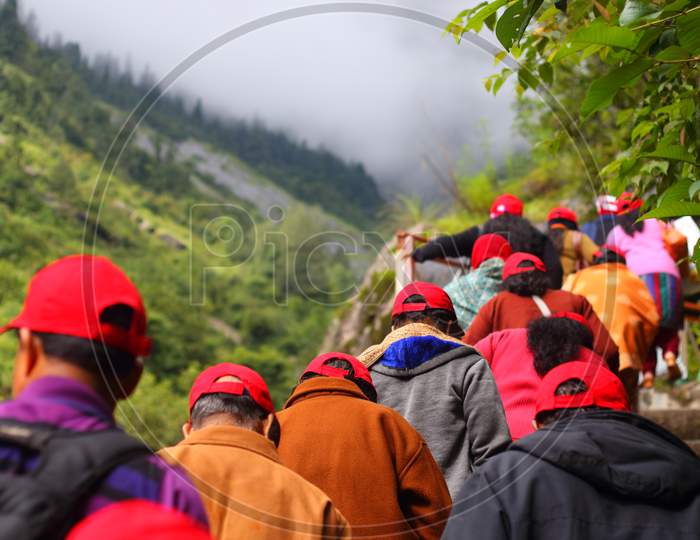Himlayan trekking ,people climbs a hill in mist