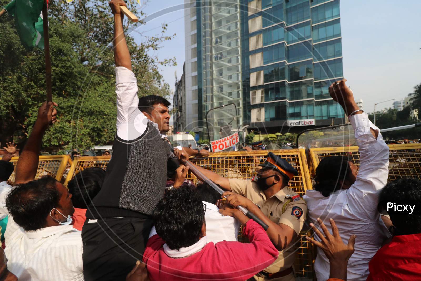 Demonstrators attempt to cross a police barricade during a protest of farmers and members of various agricultural against new farm laws passed by India's parliament, in Mumbai, India, December, 2020.