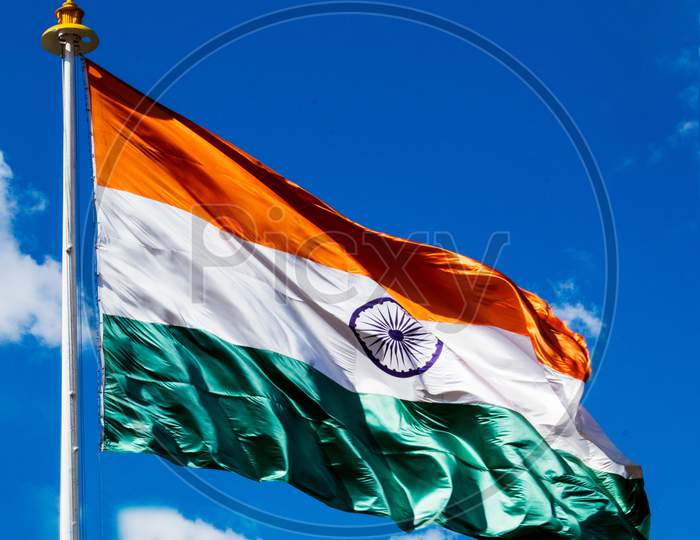 Indian Tricolor Flag on a windy day with blue sky in the background