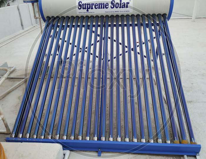 Closeup Of Supreme Solar Water Heaters, Water Storage Drum And Panels Fixed Top Of The Building