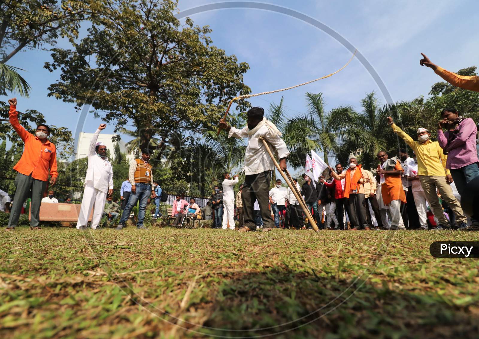 A man demonstrates his skills during a protest of farmers and members of various agricultural organisations against new farm laws passed by India's parliament, in Mumbai, India, December, 2020.