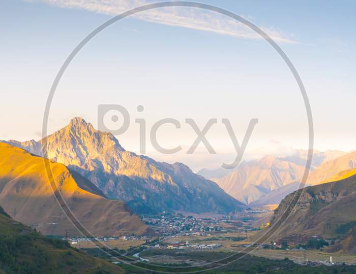 Panoramic View To Small Villages Surounded By Mountains Along The Main Road In Kazbegi National Park