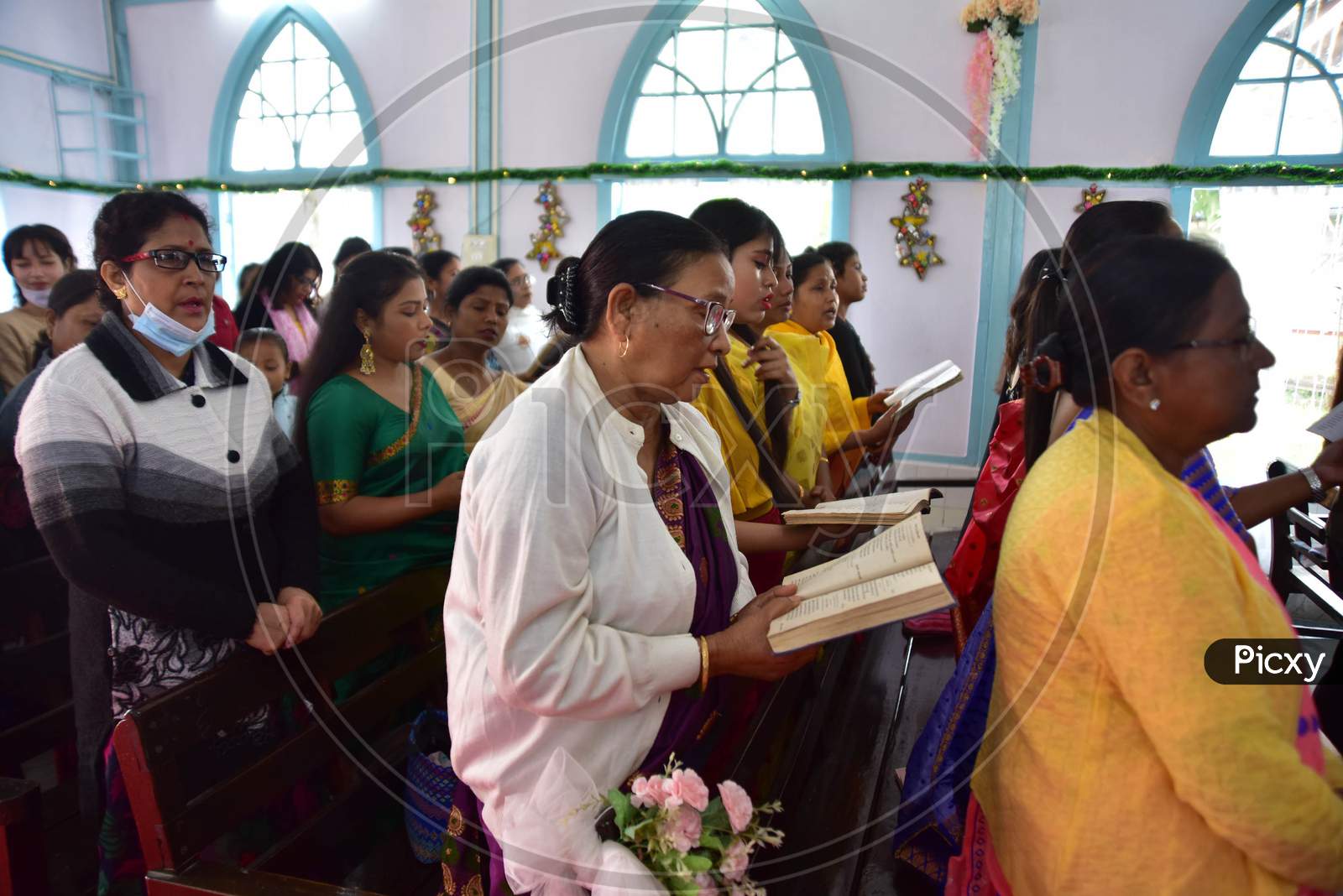 Devotees attends Christmas prayers at  a church in  Assam on Dec 25,2020