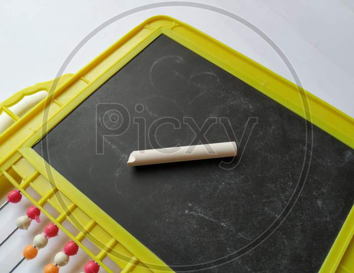 Plastic Colorful Beads for Abacus , Black Board Slate with Chalk Piece isolated on white background