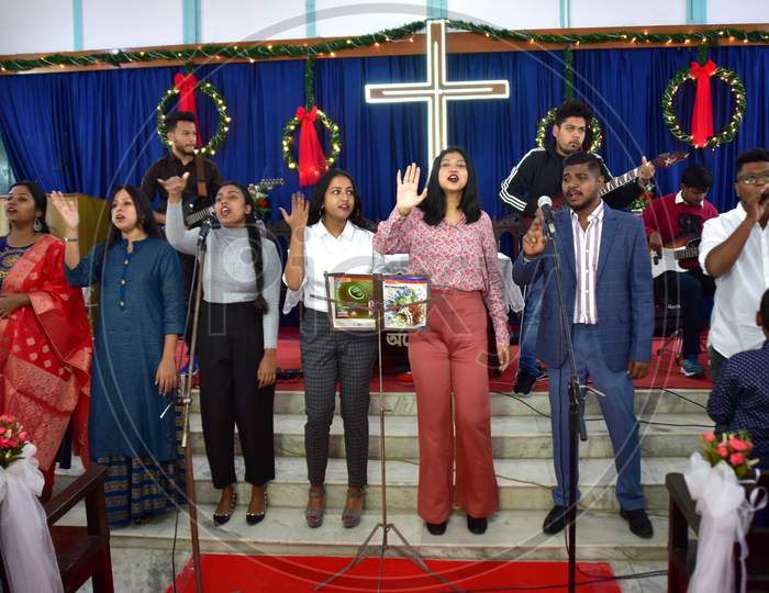 Devotees perform a  holy song on the occasion of Christmas at  a church in  Assam on Dec 25,2020.