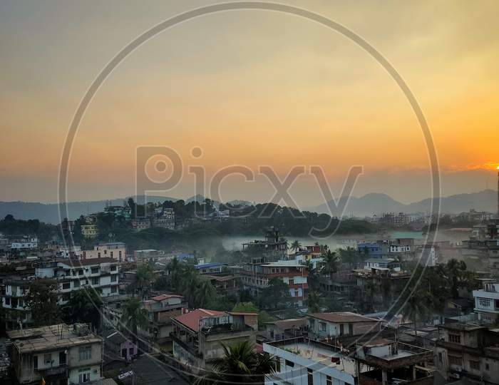 Hill top sunset view with city life