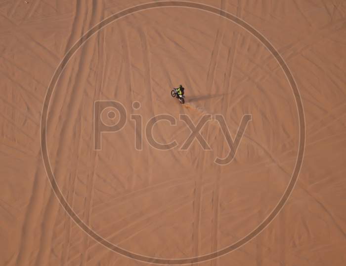 rider riding on a dune