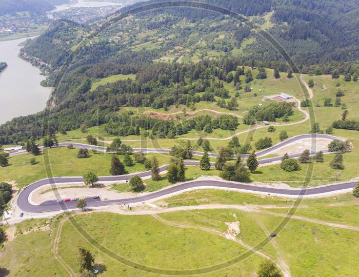 Aerial View Of Curvy Road On Mountain
