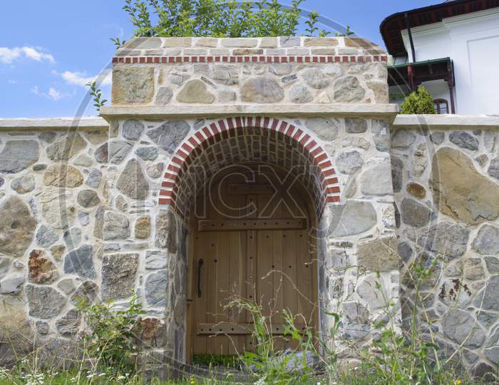 Wood Gate And Stone Wall