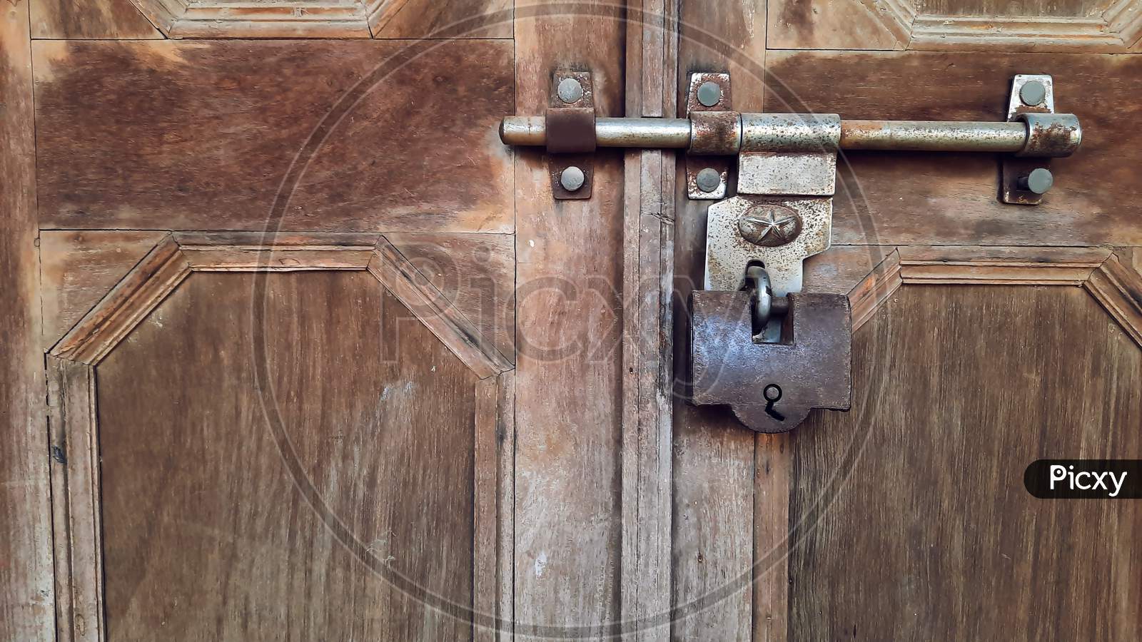 Old Big Antique Pad Lock On Closed Wooden Door Of Indian Fort