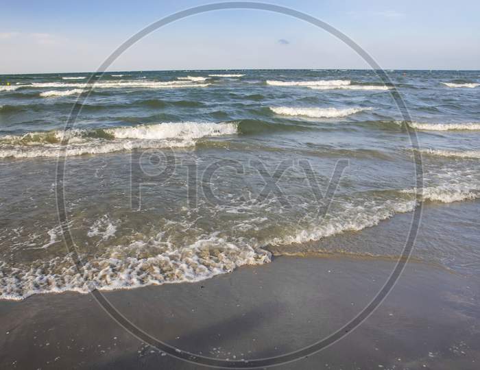 Sea Waves On Sand