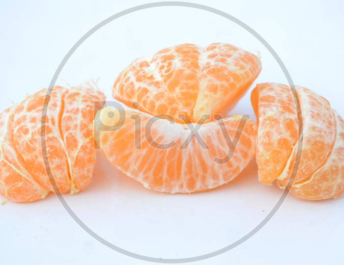 The Ripe Juicy Peels Orange Isolated On White Background.
