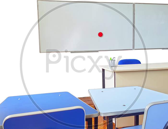 Teachers Desk And White Board In Classroom