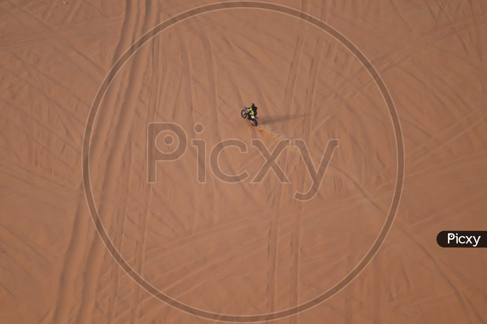 rider riding on a dune