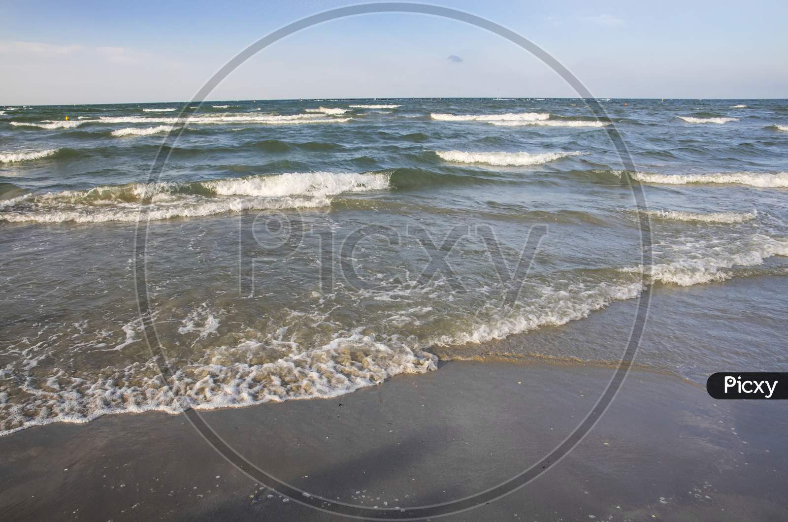 Sea Waves On Sand