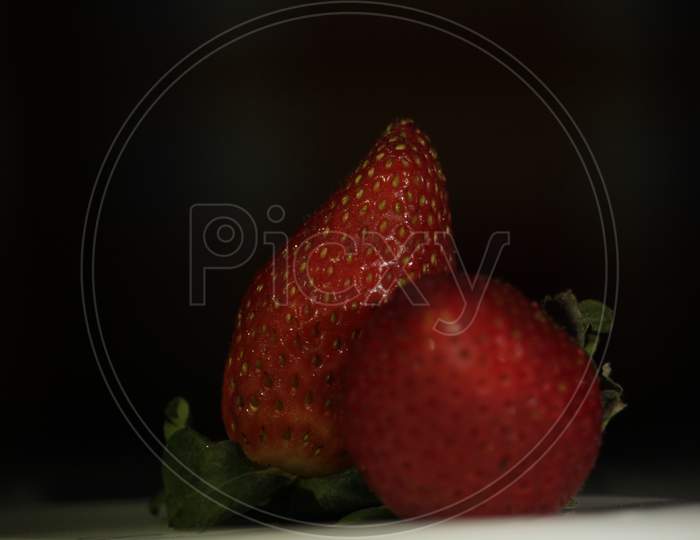 Red Fresh Organic Juicy Strawberries On A White Plate.