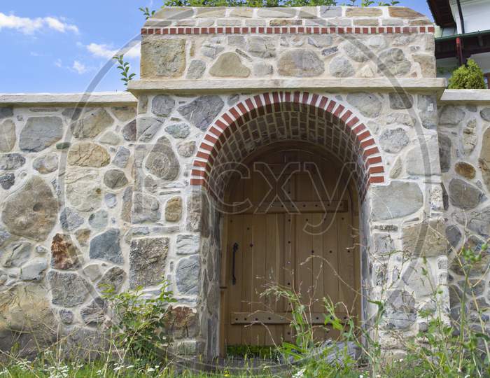 Wood Gate And Stone Wall