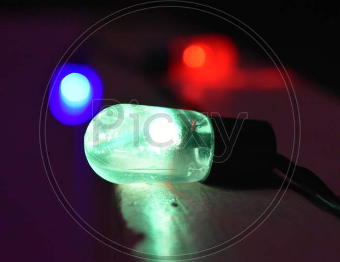Closeup of green LED bulb glowing