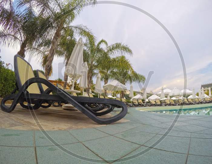 Summer Resort: Chaise Longue Near Swimming Pool