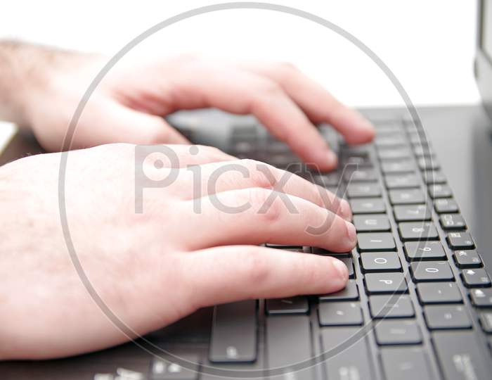 Hand On Laptop Keyboard
