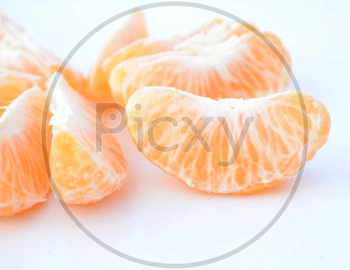 The Ripe Yellow Peels Orange Isolated On White Background.