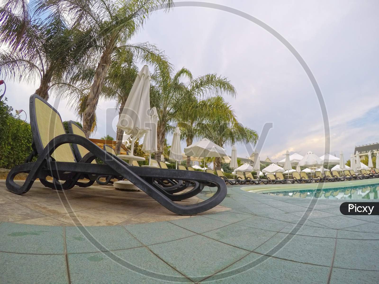 Summer Resort: Chaise Longue Near Swimming Pool