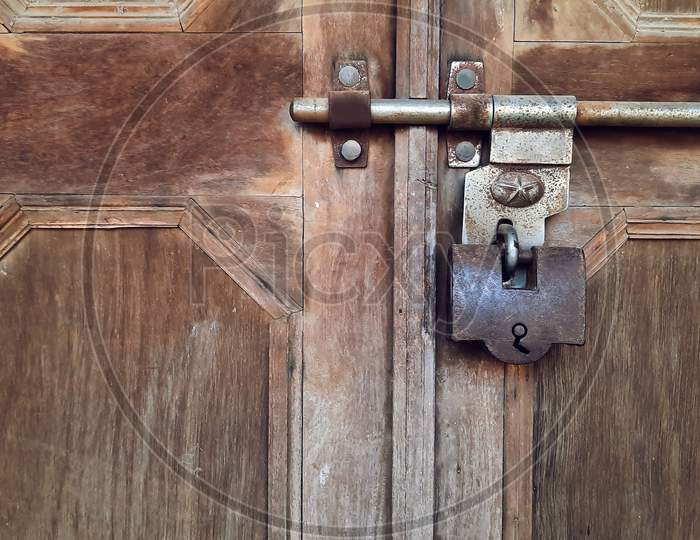 Old Big Antique Pad Lock On Closed Wooden Door Of Indian Fort
