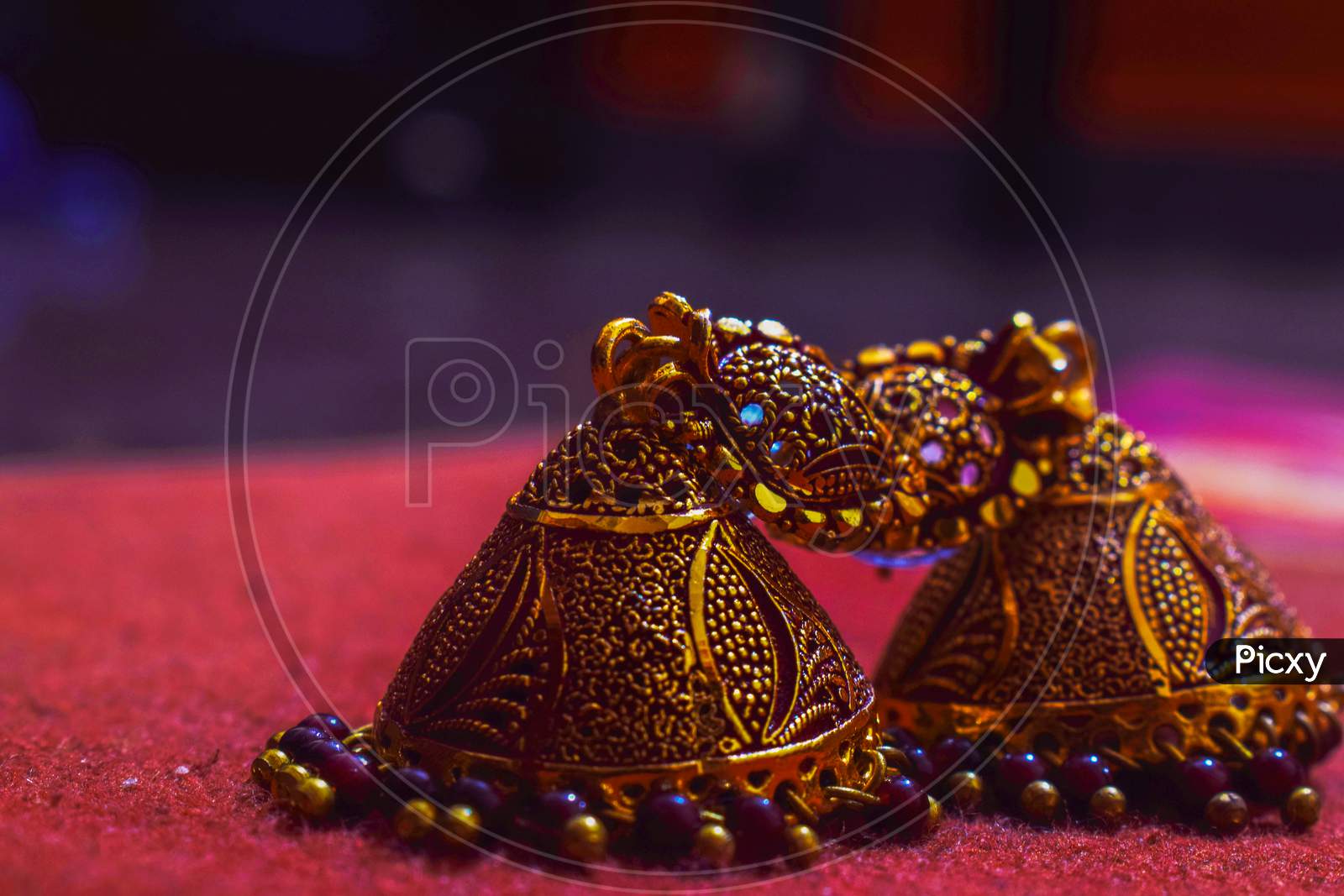 Front View Of Old Indian Style Brown Color Earrings Or Zumka .