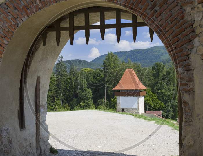 Old Gate In A Stone Fortress Wall