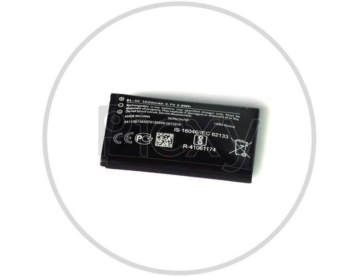 Thrissur, Kerala, India - 12-24-2020: Damaged Or Bulged Battery Of A Mobile Phone In A White Background