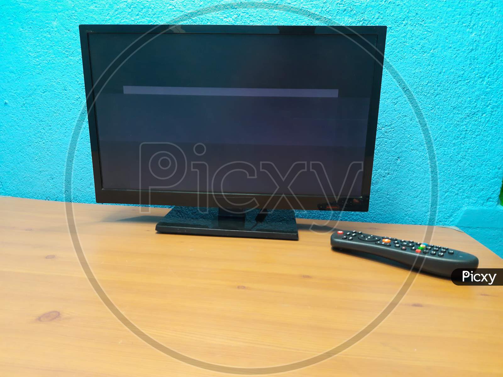Led tv and Remote in table image, tv image, Selective Focus