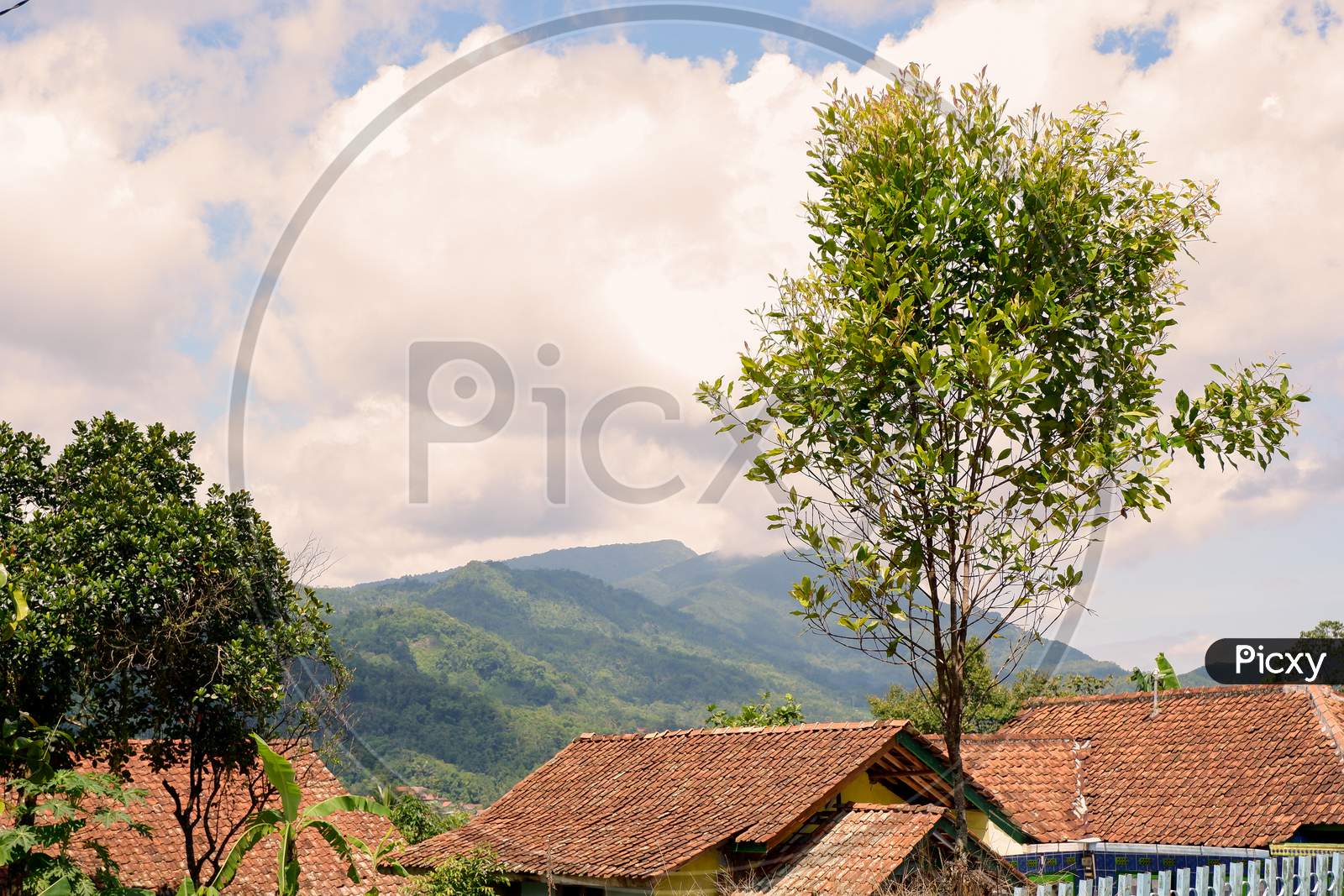 Atmosphere In The Countryside With A Background Of Clouds And Green Mountains