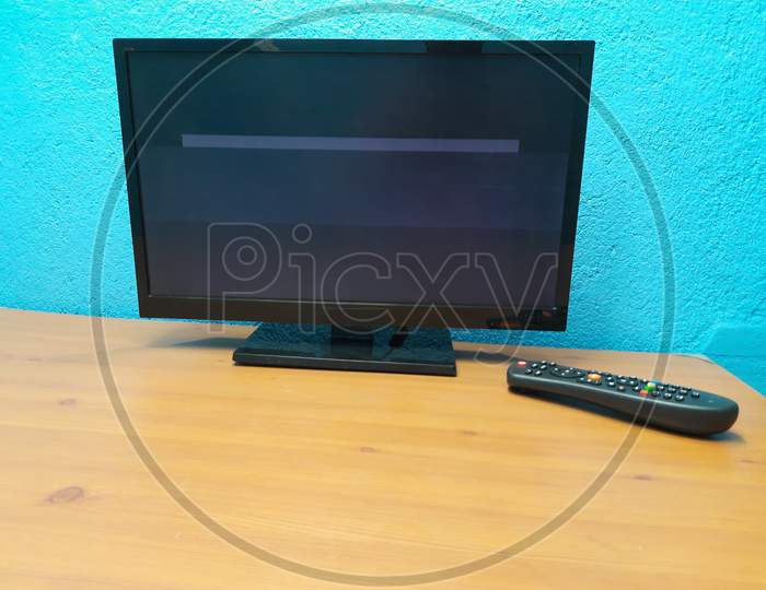 Led tv and Remote in table image, tv image, Selective Focus