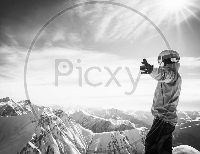 Background Image Of Male Person In Ski Suit With Hands Wide Open Enjoying Panorama Of Snowy Mountains