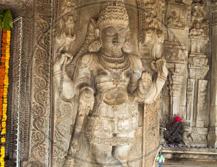 A Beautiful sculpture of an Hindu deity carved in fine detail  by dexterous hands during Vijayanagar rule at a Shiva temple in the holy town of Talakadu near Mysuru,India.