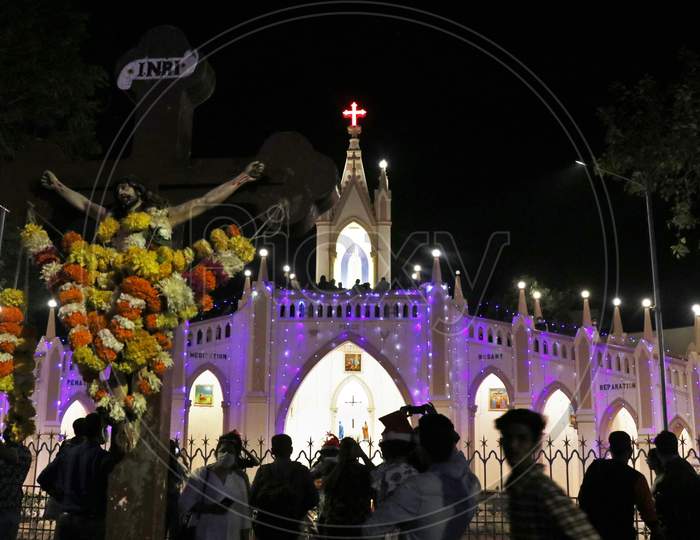 People visit a church to celebrate Christmas eve in Mumbai, India, December 24, 2020.