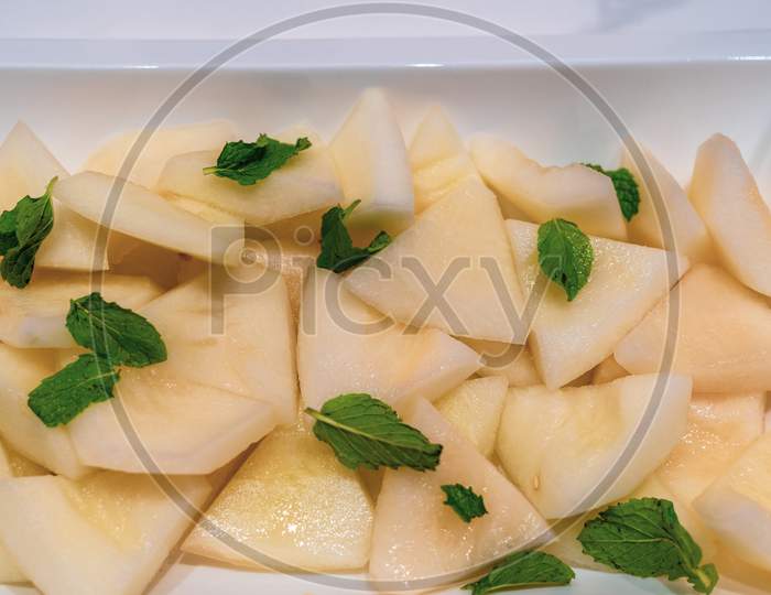 Pineapple Slices Topped With Mint Leaves