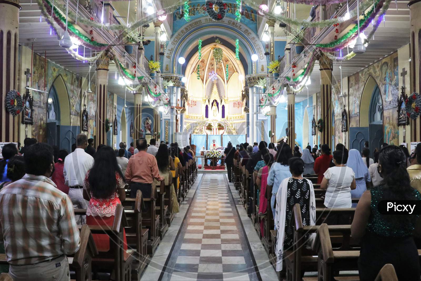 People attend mass as members of India's Christian community celebrate Christmas eve in Mumbai, India, December 24, 2020.