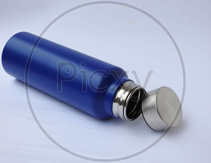 Blue Color Steel Water Bottle With Cap Open And Closed With Base Isolated On White Background