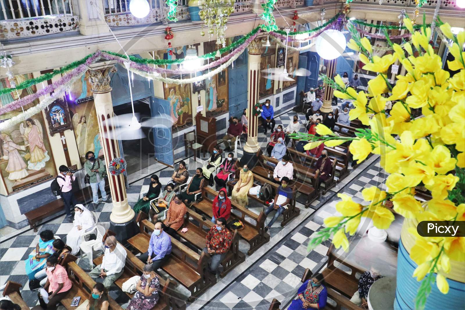 People attend mass as members of India's Christian community celebrate Christmas eve in Mumbai, India, December 24, 2020.