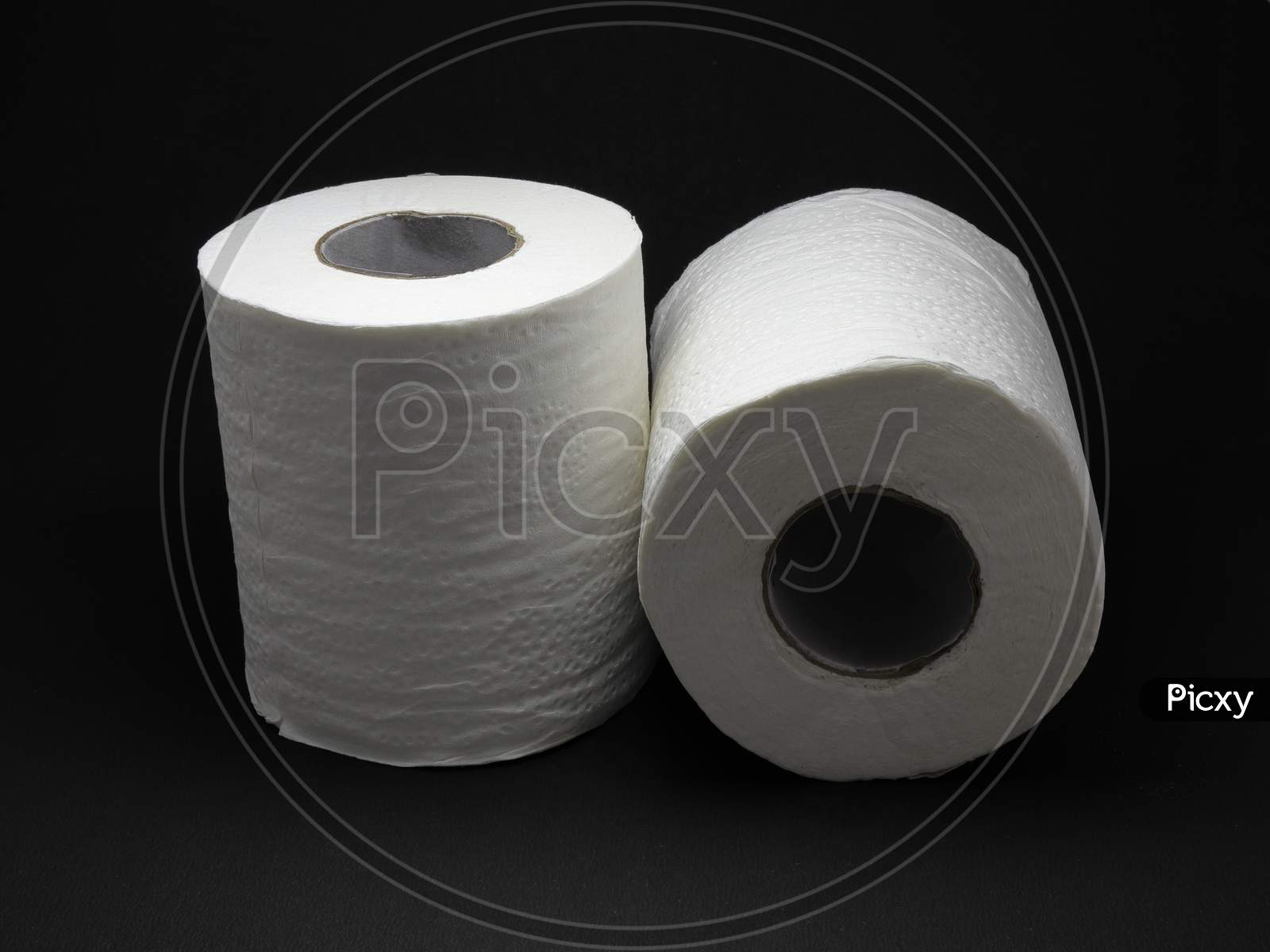 Toilet Paper Rolls Isolated on a Black Background