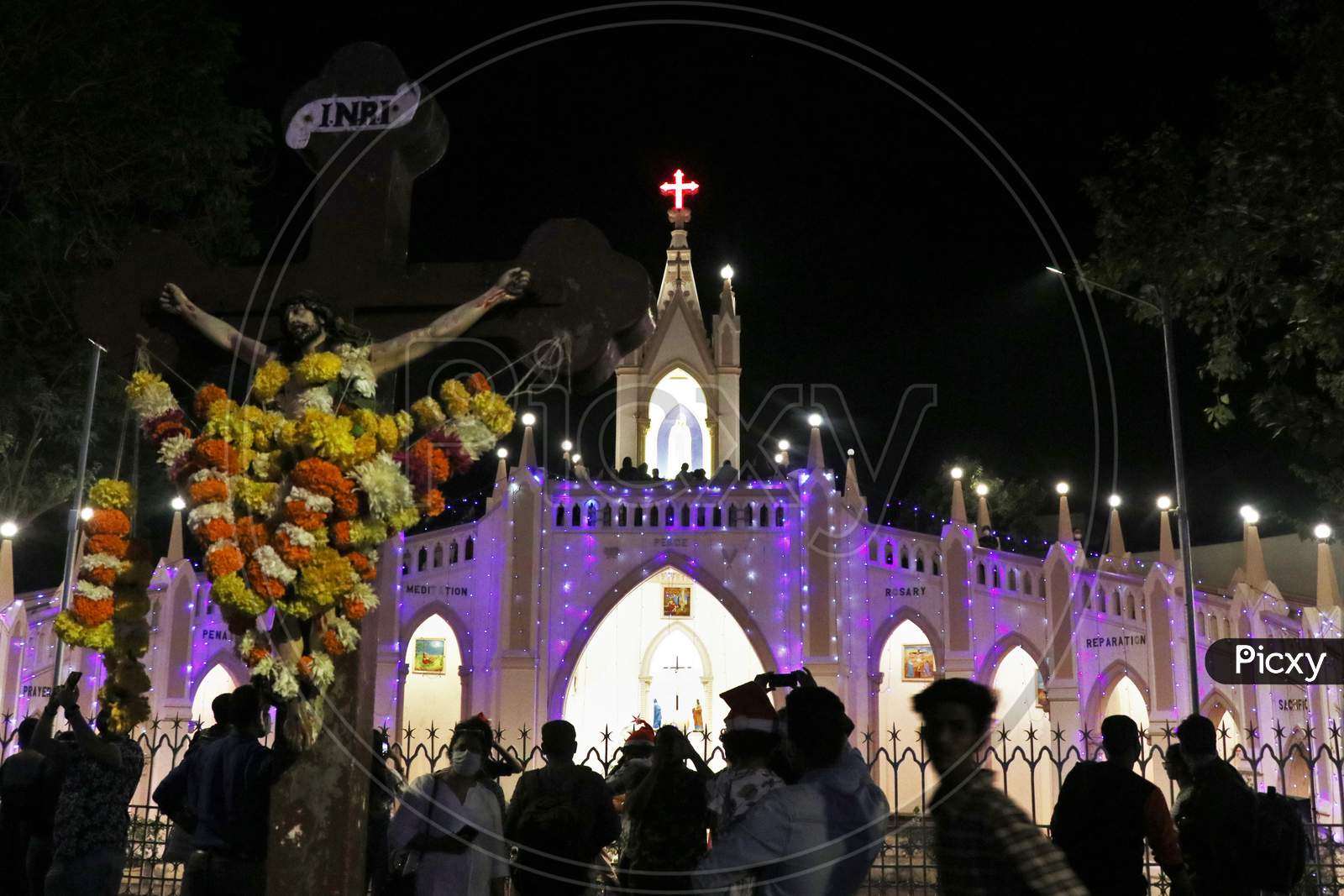 People visit a church to celebrate Christmas eve in Mumbai, India, December 24, 2020.