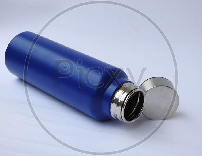 Blue Color Steel Water Bottle With Cap Open And Closed With Base Isolated On White Background