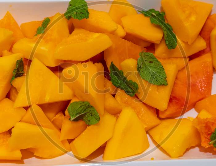 Mango Topped With Mint Leaves