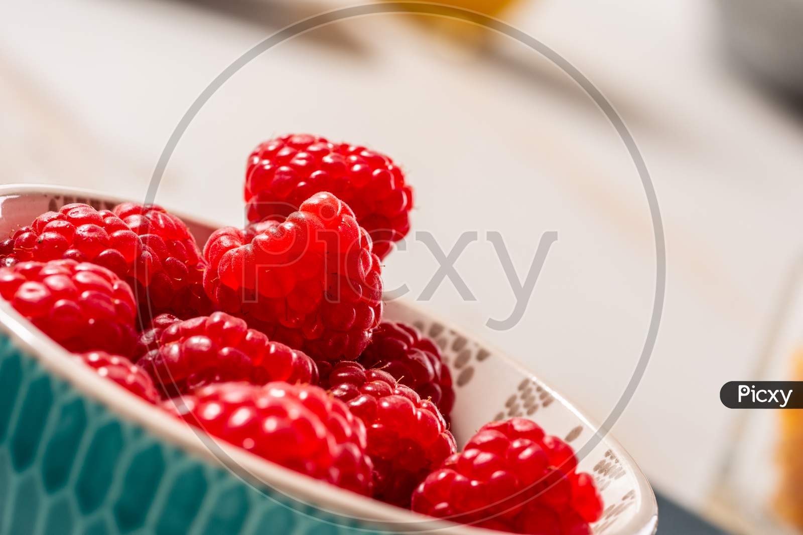 Close Up Of Bowl Of Raspberries