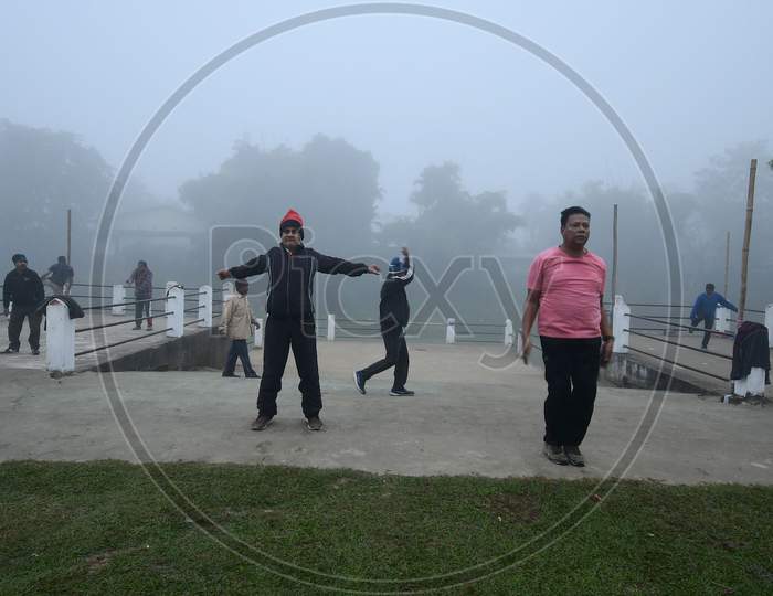 People exercise on a foggy morning  in  Assam on Dec 28,2020