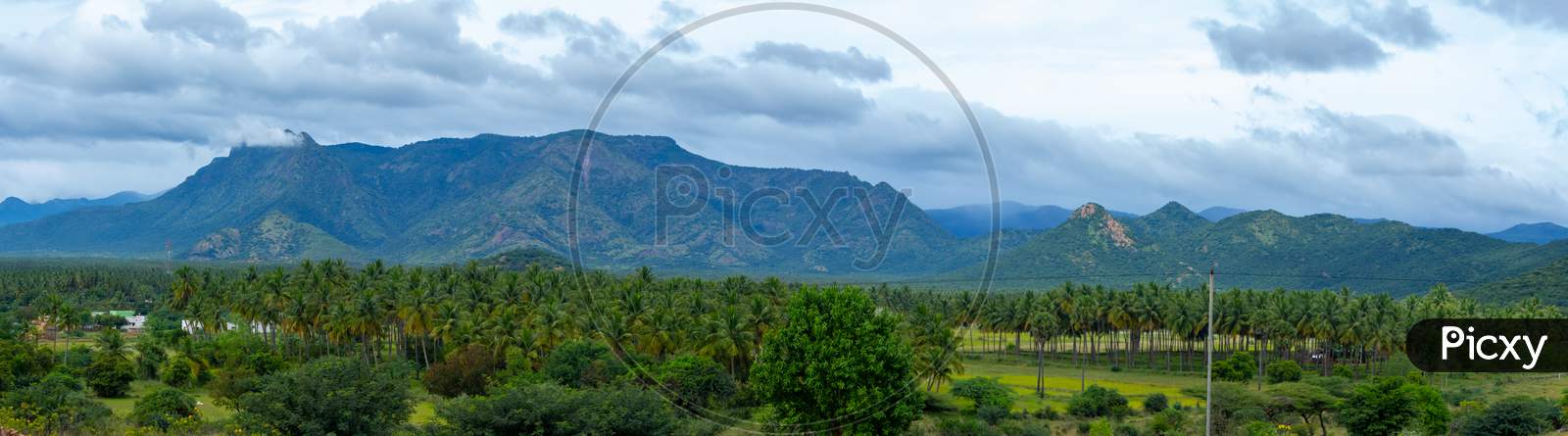 Hills And Farmlands Of South India - Tamilnadu - Panorama Landscape . Beautiful Farmlands - A View From The Hills Of Theni District, South India. Panorama Stock Images.